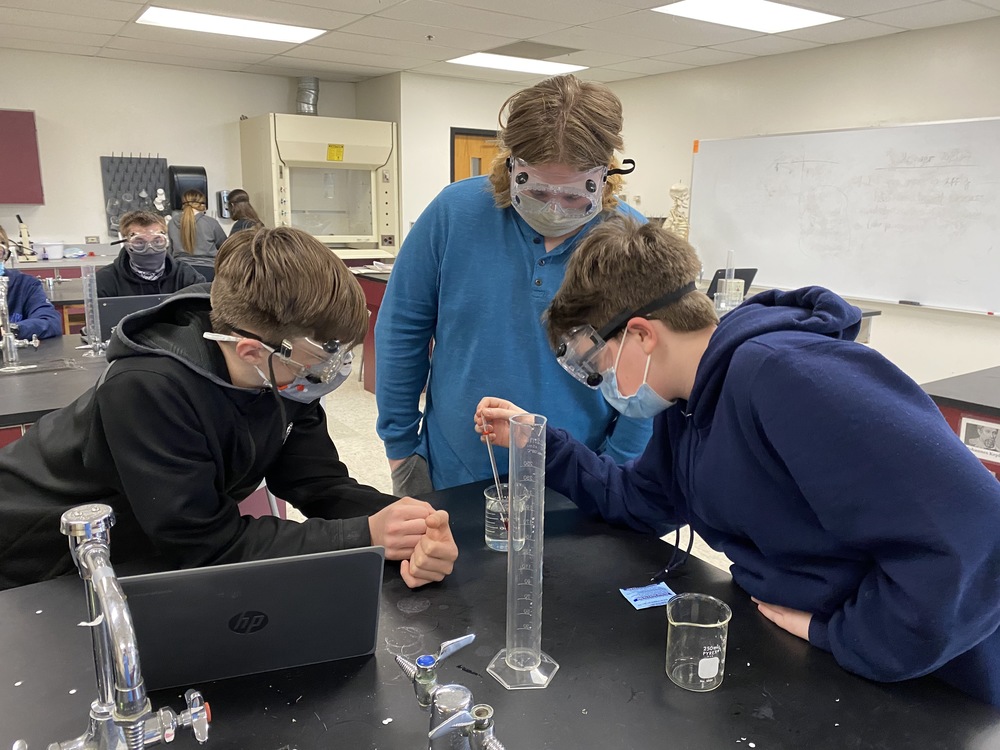 Physical Science students running an experiment